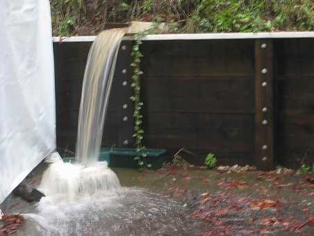 storm runoff flowing from the slide at the head of Stacey's driveway