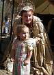 [button photo of impatient Renaissance Faire queen with poser kid]